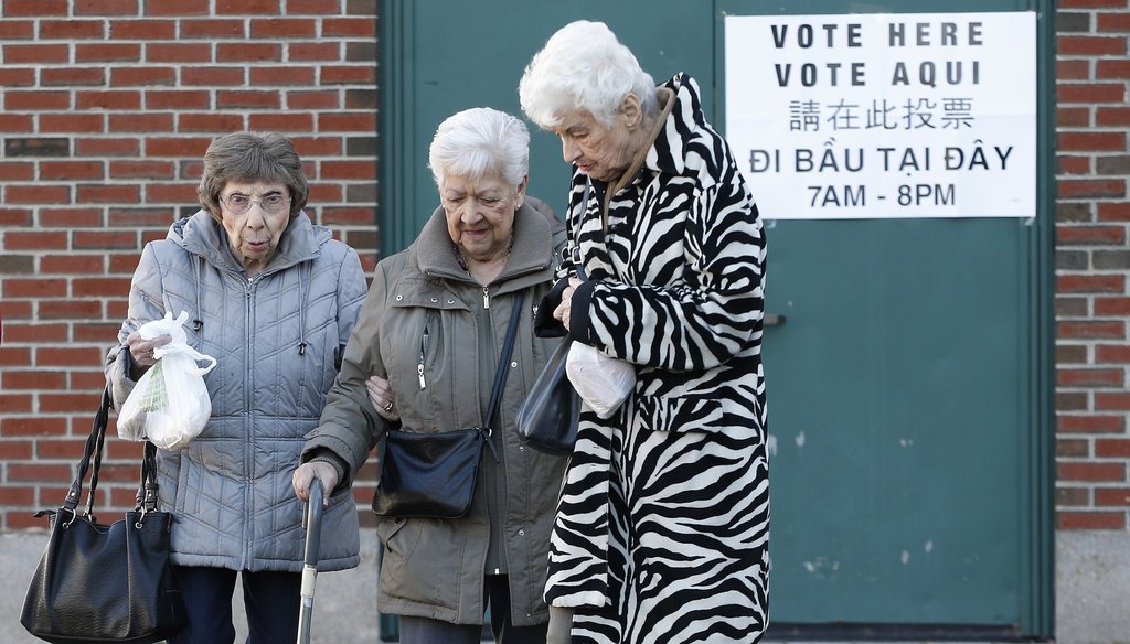 Three women leave a polling station for Massachusetts' primary election in the East Boston neighborhood of Boston, Tuesday, March 1, 2016. (AP)