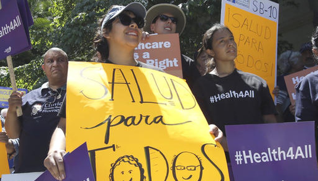 Nathaly Gonzalez, foreground, joined a rally celebrating the expansion of Medi-Cal to children and teens illegally brought to the United States, on May 16, 2016, in Sacramento. (AP/Rich Pedroncelli)