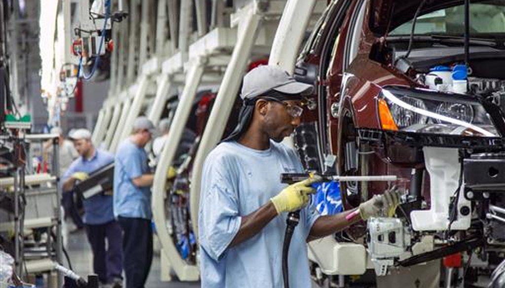 Employees at the Volkswagen plant in Chattanooga, Tenn., assemble Passat sedans on July 12, 2013. (AP/Erik Schelzig)