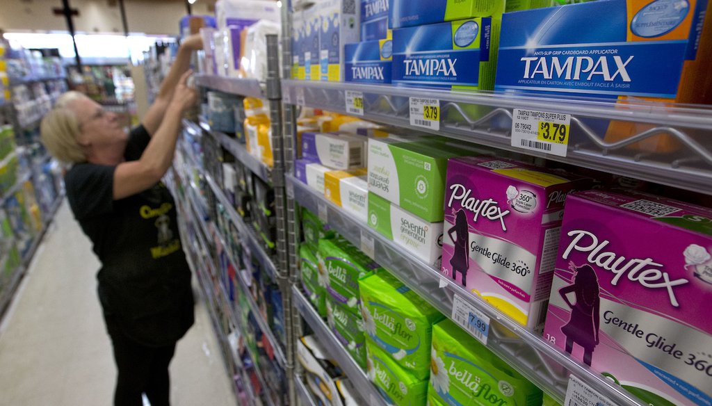 Feminine hygiene products are seen as an employee restocks a shelf at Compton's Market, Wednesday, June 22, 2016, in Sacramento, Calif. (AP)