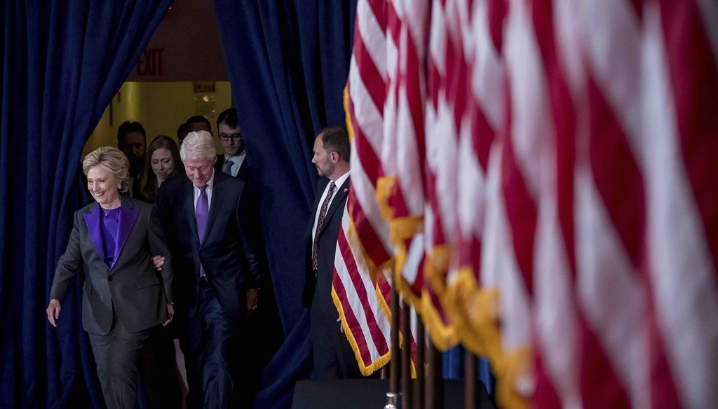 Hillary Clinton, accompanied by her husband, former President Bill Clinton, daughter Chelsea Clinton, and Chelsea's husband Marc Mezvinsky, arrives to speak to staff and supporters at the New Yorker Hotel in New York on Nov. 9, 2016.