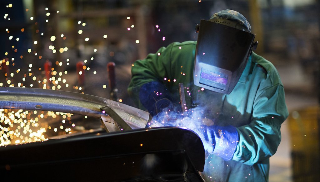 In this Sept. 18, 2015 photo, Sparks fly as a welder works on a frame for a school bus at Blue Bird Corporation's manufacturing facility in Fort Valley, Ga. Blue Bird Corporation. (AP Photo/David Goldman)