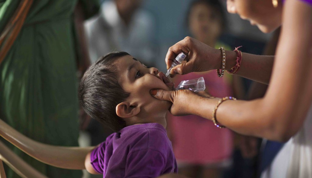 An Indian medical volunteer administers a dose of Polio immunization to a child in Hyderabad, India, on Jan. 29, 2017. (AP)