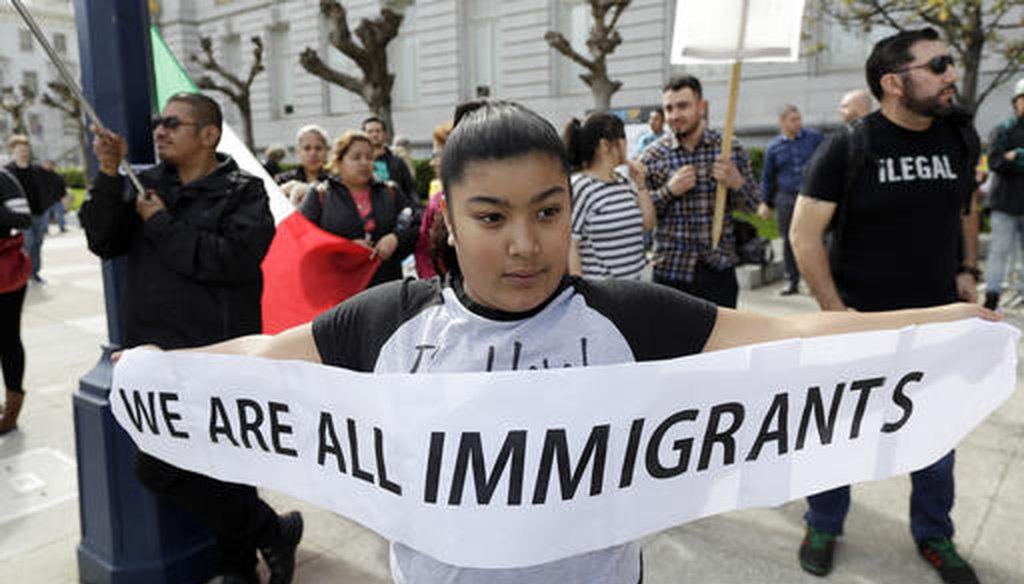 Delilah Gutierrez, 10, holds a sign during a protest against President Donald Trump's efforts to crack down on immigration on Feb. 16, 2017, in San Francisco. (AP/Marcio Jose Sanchez)