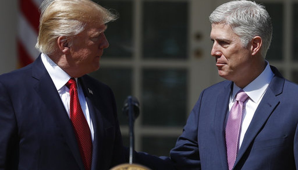 President Donald Trump greets his Supreme Court nominee, Neil Gorsuch, in the Rose Garden.