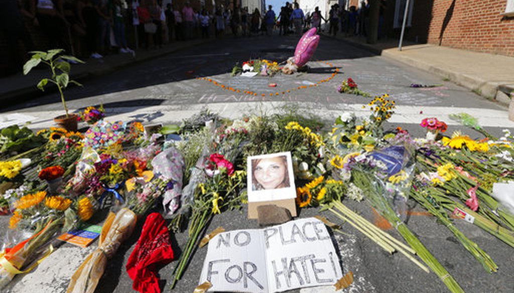 A makeshift memorial of flowers and a photo of Heather Heyer, in Charlottesville, Va., Aug. 13, 2017. Heyer died when a car rammed into a group of people who were protesting white supremacists who had gathered in the city for a rally. (AP/Steve Helber)