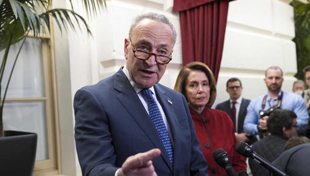 Senate Minority Leader Chuck Schumer, D-N.Y., speaks to reporters before House and Senate tax bill conferees met to work on the sweeping overhaul of the nation's tax laws on Dec. 13, 2017. (AP/J. Scott Applewhite)