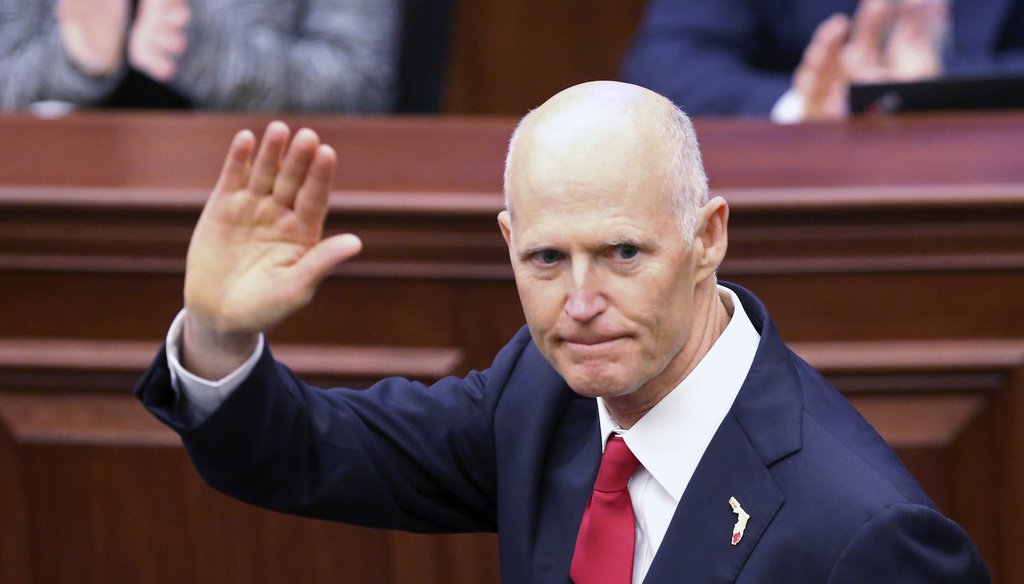 Gov. Rick Scott waves as he is introduced to the Senate on the first day of legislative session, Tuesday, Jan. 9, 2018, in Tallahassee, Fla. (AP Photo/Steve Cannon)