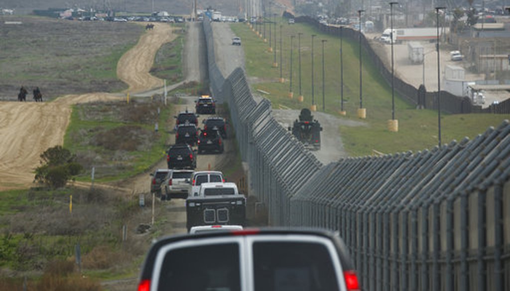 A motorcade carrying President Donald Trump drives along the border before look at border wall prototypes, Tuesday, March 13, 2018, in San Diego. (AP Photo/Evan Vucci)