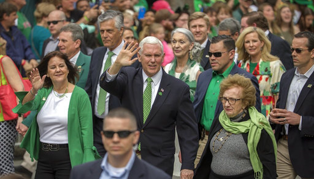 Vice President Mike Pence, center, his wife Karen Pence, left, and his mother Nancy Pence Fritch, right, march in the St. Patrick's Day parade Saturday, March 17, 2018, in Savannah, Ga. (AP Photo/Stephen B. Morton)