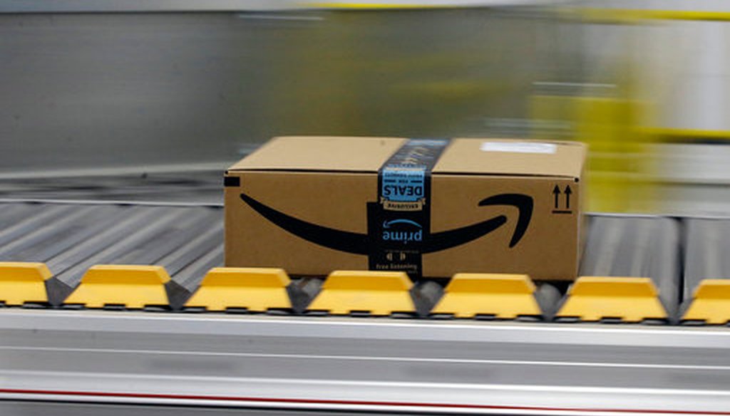 In this Feb. 9, 2018, file photo, a box for an Amazon prime customer moves through the new Amazon Fulfillment Center in Sacramento, Calif.  (AP/Rich Pedroncelli)