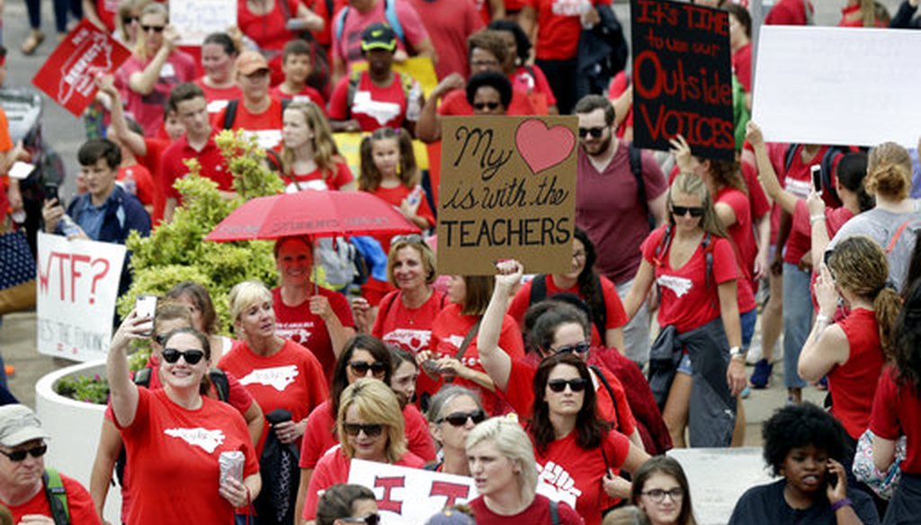 Protesting teachers march toward the Legislative Building during a rally at the General Assembly in Raleigh, N.C., Wednesday, May 16, 2018. (AP/Gerry Broome)