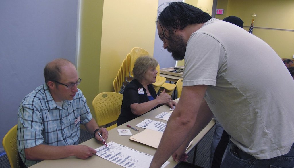 A North Dakota resident receives voting instructions at the downtown Fargo public library on June 12, 2018 in Fargo, N.D.