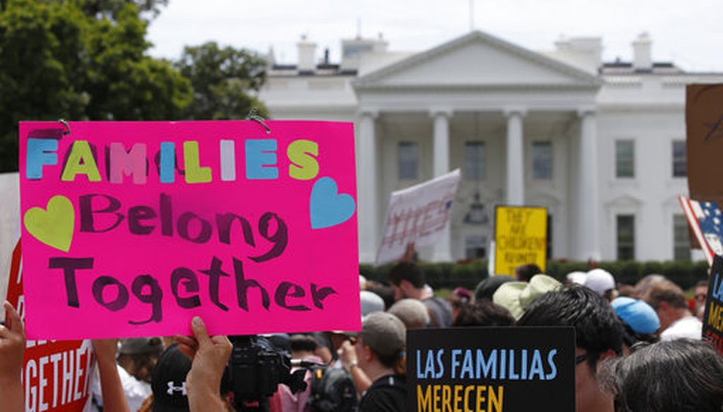 In this June 20, 2018, file photo, activists march past the White House to protest the Trump administration's approach to illegal border crossings and separation of children from immigrant parents in Washington. (AP Photo/Alex Brandon, file)