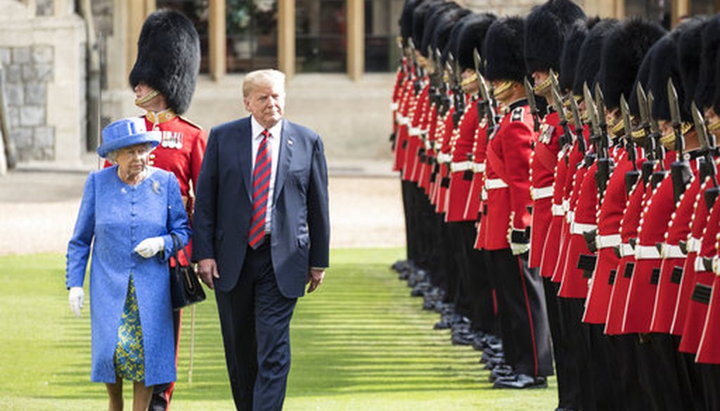U.S. President Donald Trump with Queen Elizabeth II, inspects the Guard of Honour at Windsor Castle in Windsor, England. (AP Photo/Pablo Martinez Monsivais)