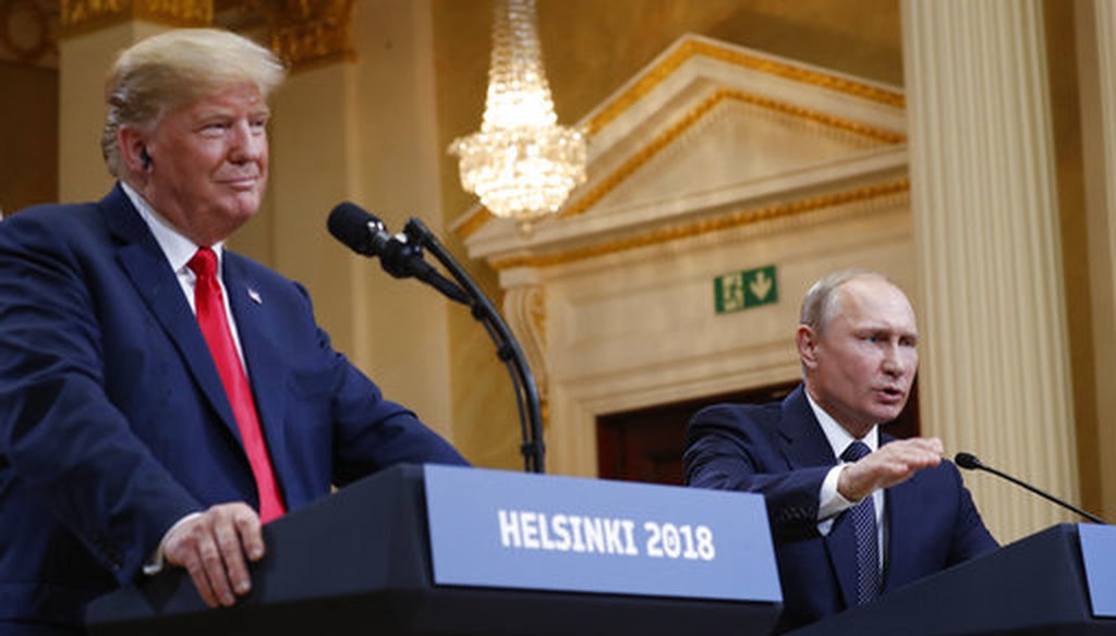 Russian President Vladimir Putin gestures while speaking as President Donald Trump looks on during their joint news conference in Helsinki on July 16, 2018. (AP/Pablo Martinez Monsivais)