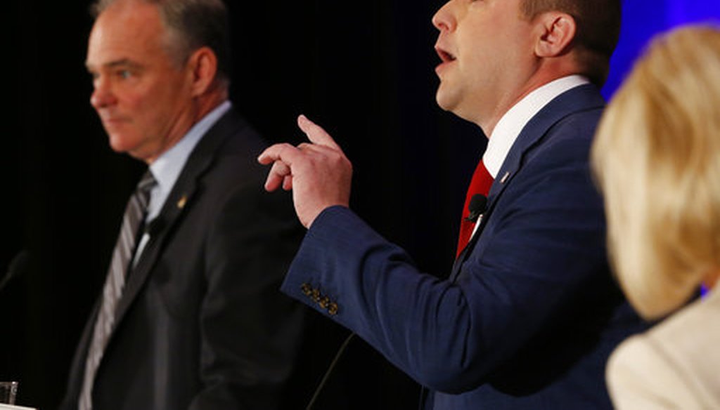 Sen. Tim Kaine listens as Republican Corey Stewart gestures during the Virginia Bar Association debate in Hot Springs, Va., on July 21, 2018 (AP/Steve Helber)