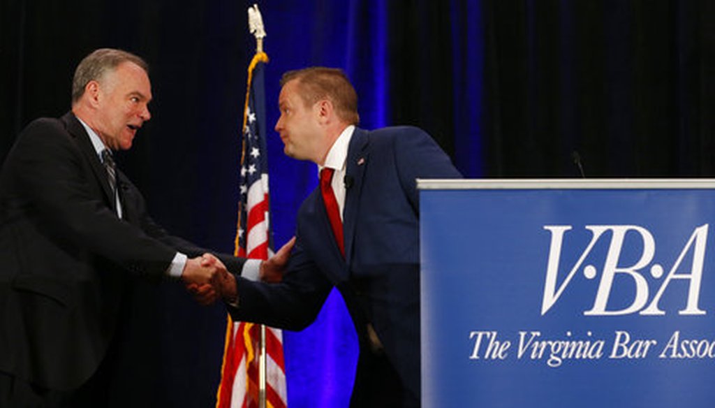 Sen. Tim Kaine and Republican challenger Corey Stewart shake hands at the end of the Virginia Bar Association debate in Hot Springs, Va., on July 21, 2018. (AP/Steve Helber)