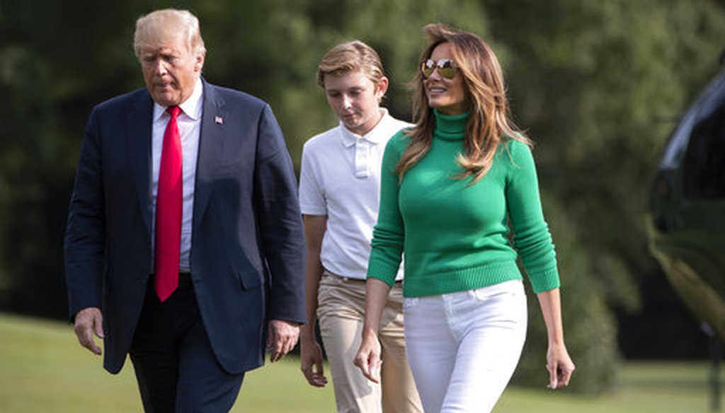 President Donald Trump, with first lady Melania Trump and their son Barron, arrives at the White House in Washington, Sunday, Aug. 19, 2018. (AP Photo/J. Scott Applewhite)
