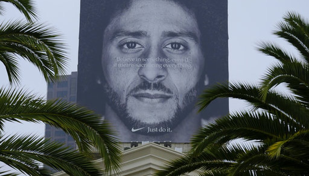 A billboard stands on top of a Nike store showing former San Francisco 49ers quarterback Colin Kaepernick on Sept. 5, 2018, in San Francisco. (AP/Eric Risberg)