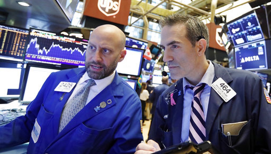 Specialist Meric Greenbaum, left, and trader Gregory Rowe work on the floor of the New York Stock Exchange on Sept. 14, 2018. (AP/Richard Drew)