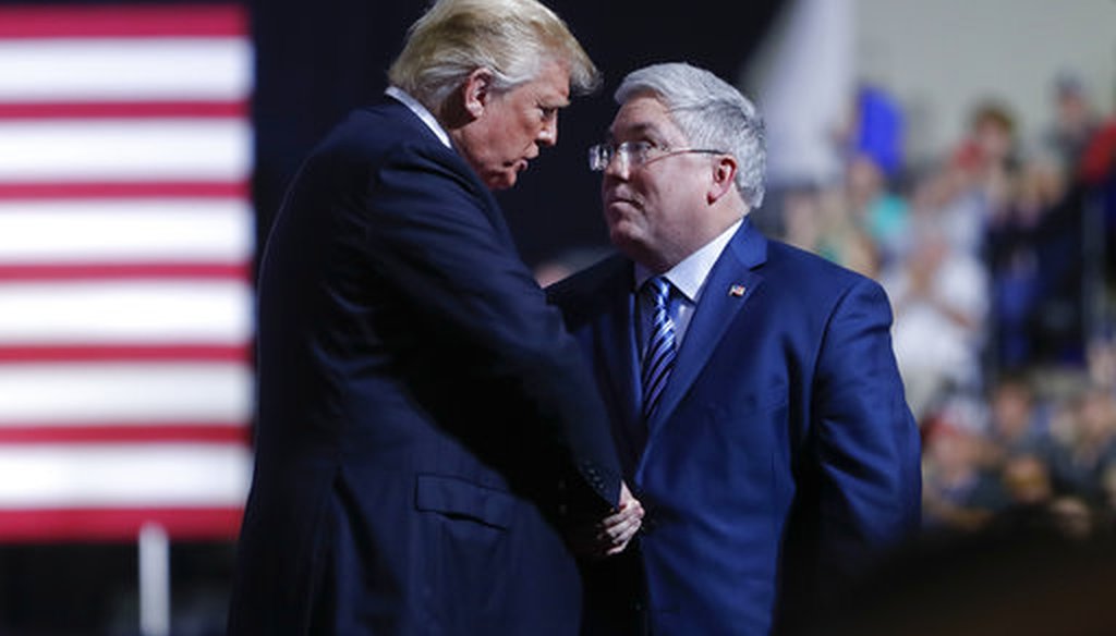 President Donald Trump, left, shakes hands with Republican Senate candidate Patrick Morrisey, right, on stage during a campaign rally on Sept. 29, 2018, in Wheeling, W.Va. (AP/Pablo Martinez Monsivais)