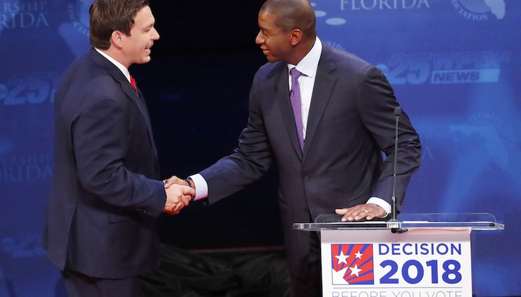 Florida gubernatorial candidates, Republican Ron DeSantis, left, and Democrat Andrew Gillum shake hands before a debate on Oct. 24, 2018, at Broward College in Davie, Fla. (AP)