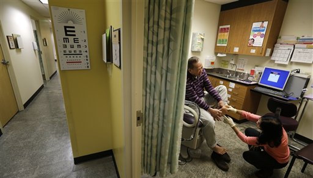 Chan Lai Ly has his feet examined as part of a regular check-up related to his diabetes in Seattle. (AP)