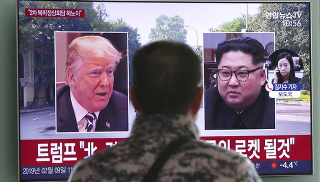 A man in Seoul, South Korea, watches a TV screen showing President Donald Trump and North Korean leader Kim Jong Un on Feb. 9, 2019. (AP)