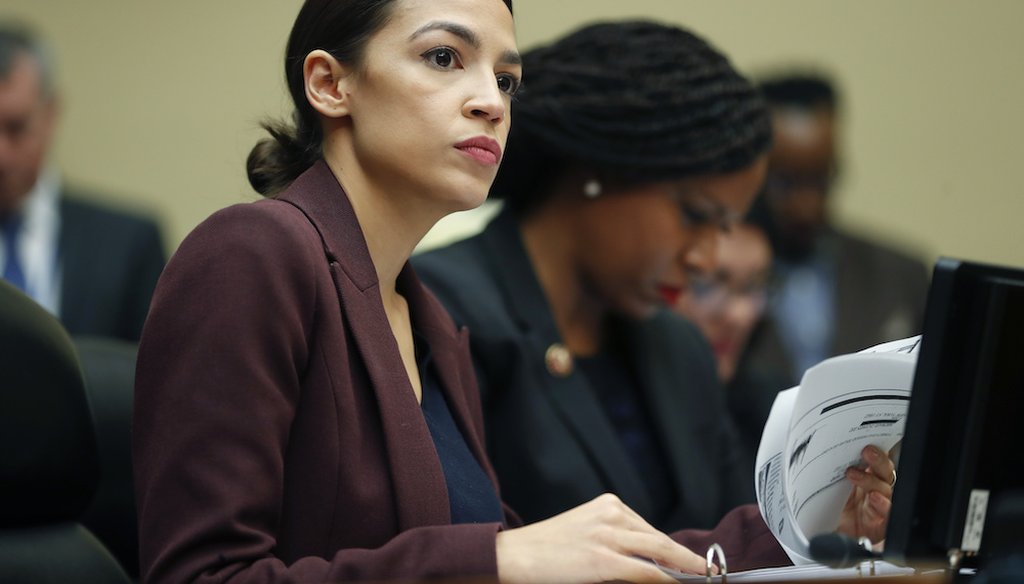 Rep. Alexandria Ocasio-Cortez, D-N.Y.,  looks over her notes during testimony by Michael Cohen before the House Oversight and Reform Committee on Feb. 27, 2019. (AP)