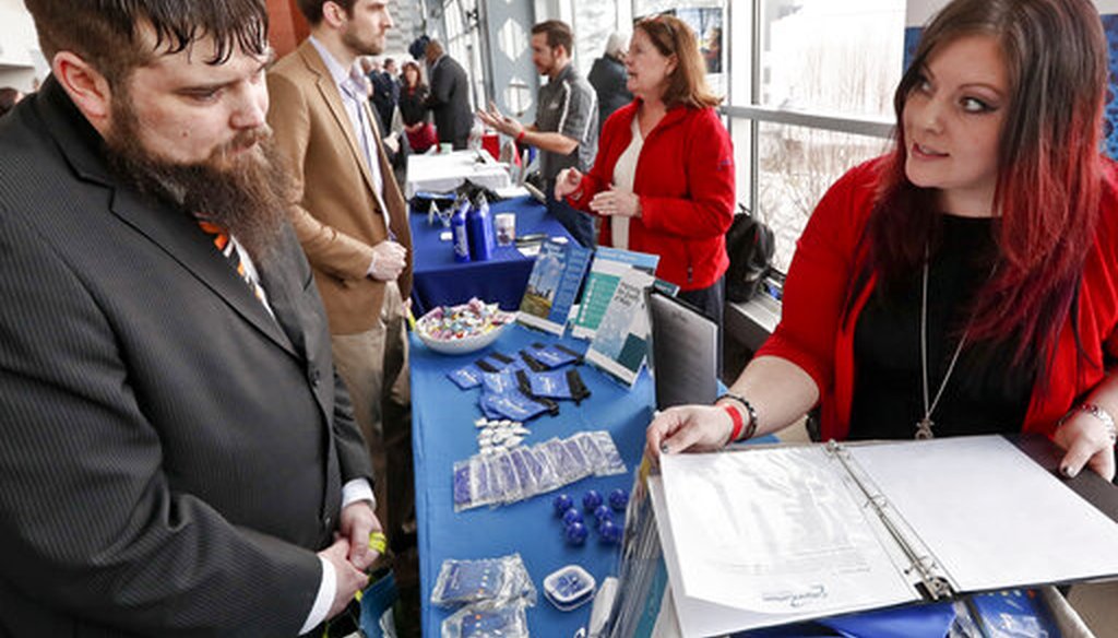 Visitors to a Pittsburgh veterans job fair meet with recruiters at Heinz Field on March 7, 2019. (AP)