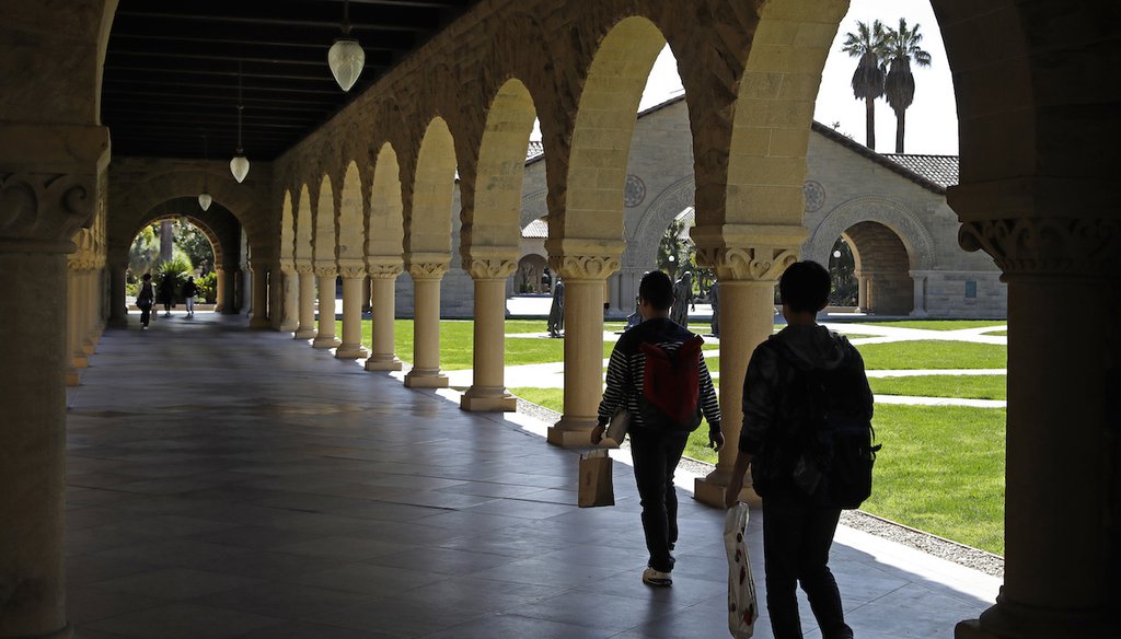 People walk on the Stanford University campus on March 14, 2019, in Santa Clara, Calif. (AP)