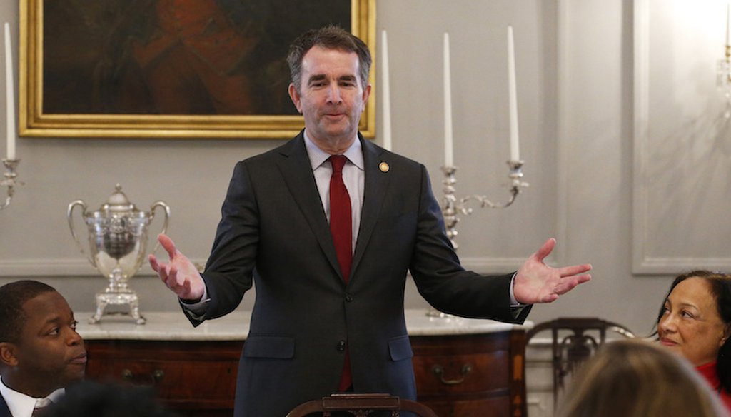 Gov. Ralph Northam, center, greets members of the Richmond 34 and other African-American leaders for a breakfast at the Governors Mansion at the Capitol in Richmond, Va Feb. 22, 2019. (AP Photo/Steve Helber)