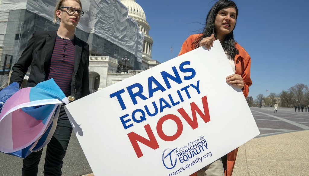 Ketaki Deo, right, and Charlie Whittington, students at George Washington University, arrive for an event supporting The Equality Act, a comprehensive nondiscrimination bill for LGBT rights, on Capitol Hill in Washington on April 1, 2019. (AP)