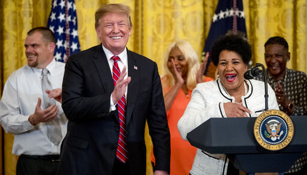 President Donald Trump reacts as Alice Johnson speaks to the media at the 2019 Prison Reform Summit and First Step Act Celebration at the White House in Washington on April 1, 2019. (AP/Harnik)