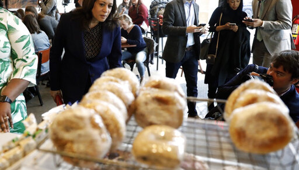 Democratic presidential candidate Kamala Harris looks at pastries on display during a stop at a local cafe on April 11, 2019, in Des Moines, Iowa. (AP)