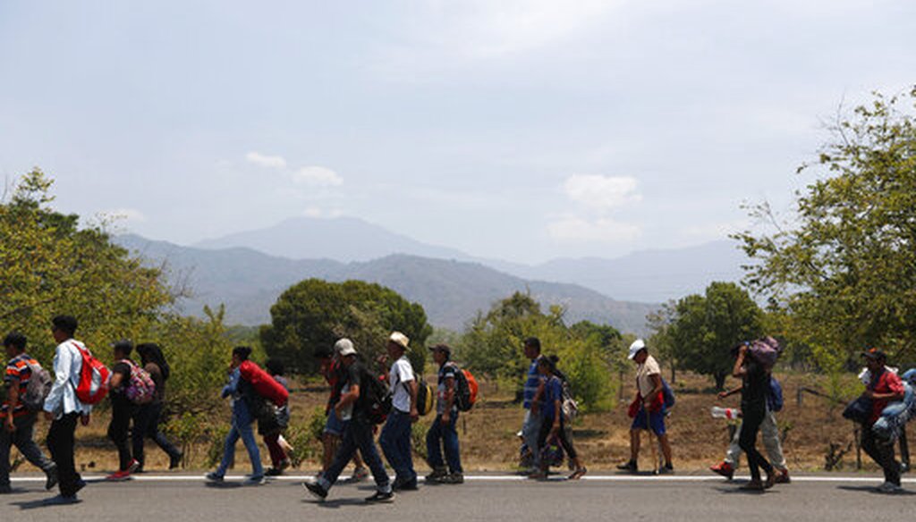 Central American migrants traveling in a caravan to the U.S. walk through Tonala, Chiapas state, Mexico, April 21, 2019. (AP/Moises Castillo)