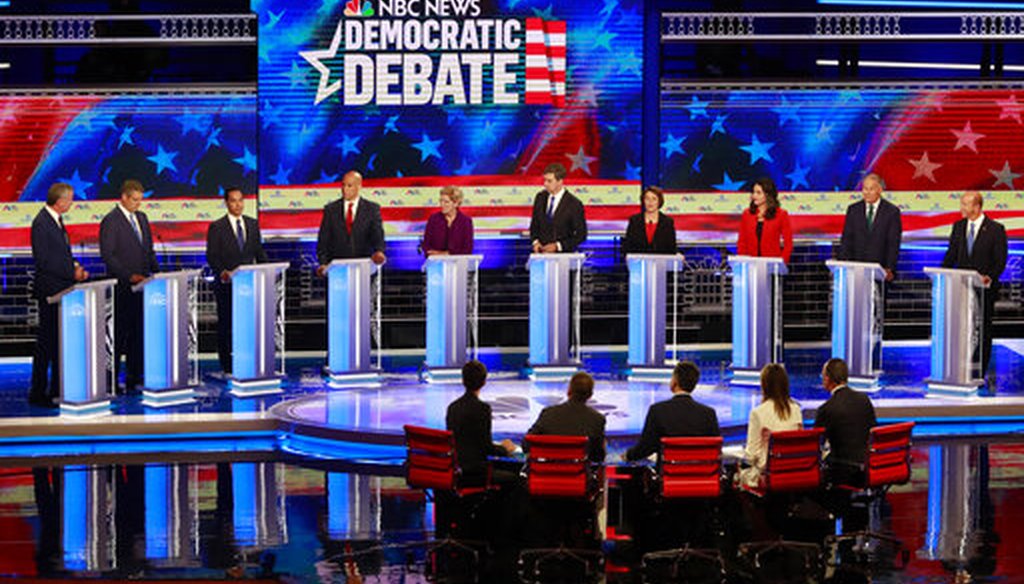 The set of the Democratic primary debate hosted by NBC News on June 27, 2019, in Miami, featured flag imagery and a patriotic color pallet of red, white and blue. (AP Photo/Wilfredo Lee)
