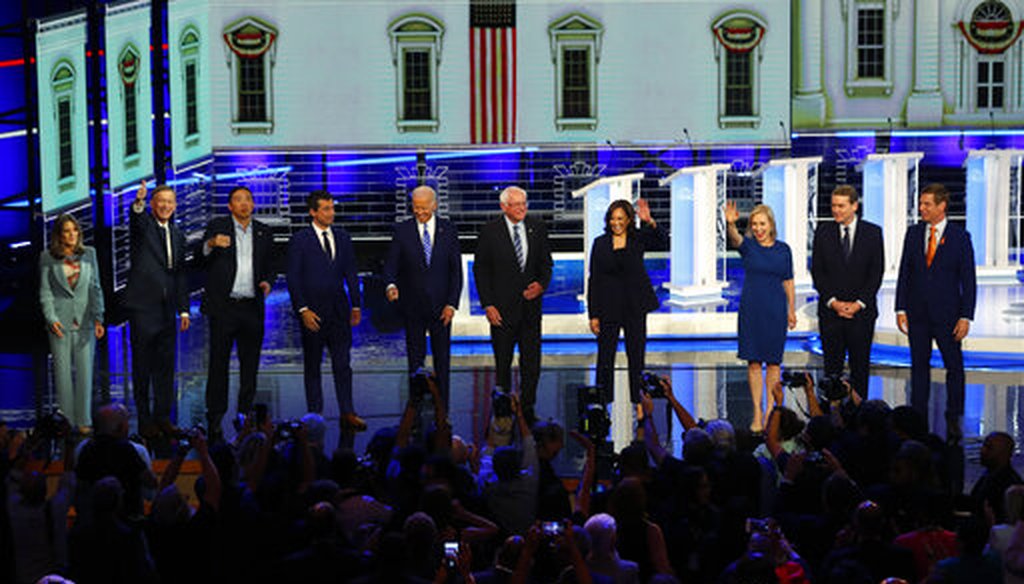 Democratic presidential candidates wave as they enter the stage for the second night of the Democratic primary debate, Thursday, June 27, 2019, in Miami (AP).
