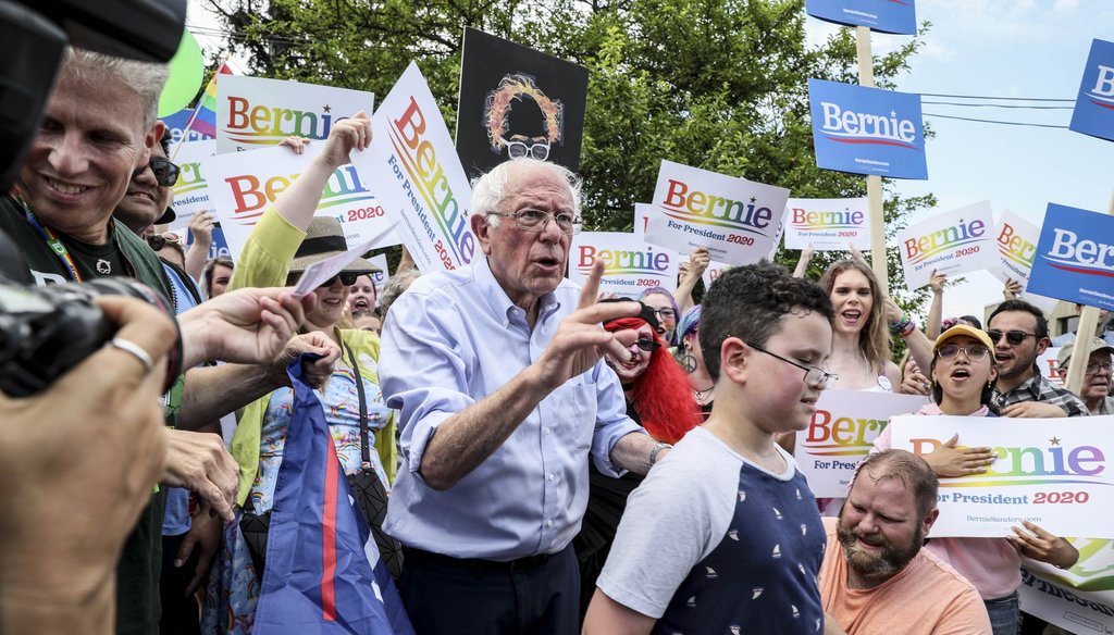 Democratic presidential candidate Sen. Bernie Sanders, I-Vt., organizes a picture with supporters who marched with him in the Nashua Pride Parade in Nashua, N.H., on June 29, 2019. (AP)