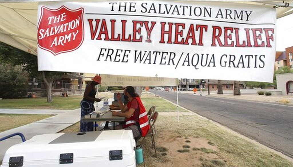 Salvation Army volunteers keep a hydration stations open as temperatures are expected to hit 113-degrees July 11, 2019, in Phoenix. (AP)