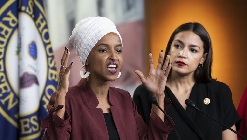 U.S. Rep. Ilhan Omar, D-Minn., left, joined at right by U.S. Rep. Alexandria Ocasio-Cortez, D-N.Y., responds to base remarks by President Donald Trump in Washington on July 15, 2019. (AP)