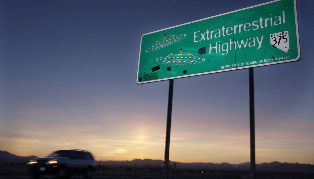 In this April 10, 2002, file photo, a vehicle moves along the Extraterrestrial Highway near Rachel, Nev., the closest town to Area 51. (AP Photo/Laura Rauch, File)
