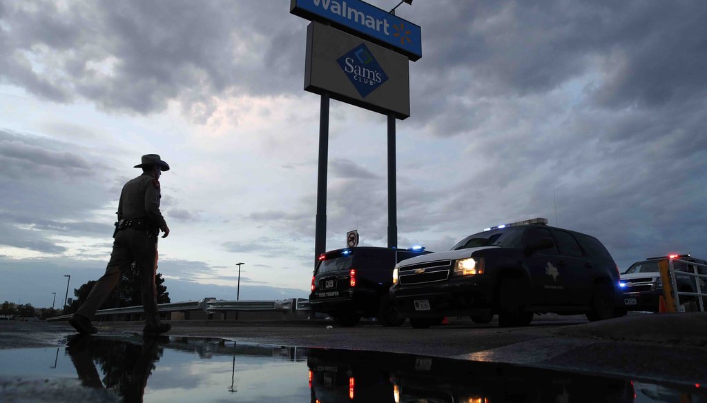 Law enforcement officials block a road at the scene of a mass shooting at a shopping complex Sunday, Aug. 4, 2019, in El Paso, Texas. (AP)
