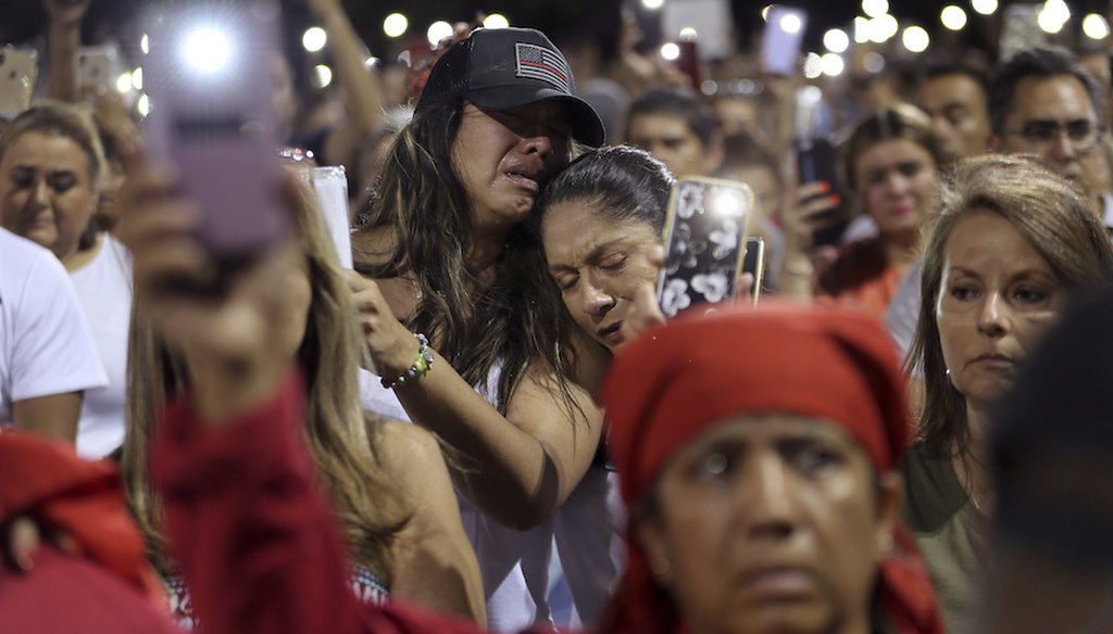 People grieve during the Hope Border Institute prayer vigil Sunday, Aug. 4, 2019 in El Paso, Texas, a day after a mass shooting at a Walmart store. (AP)