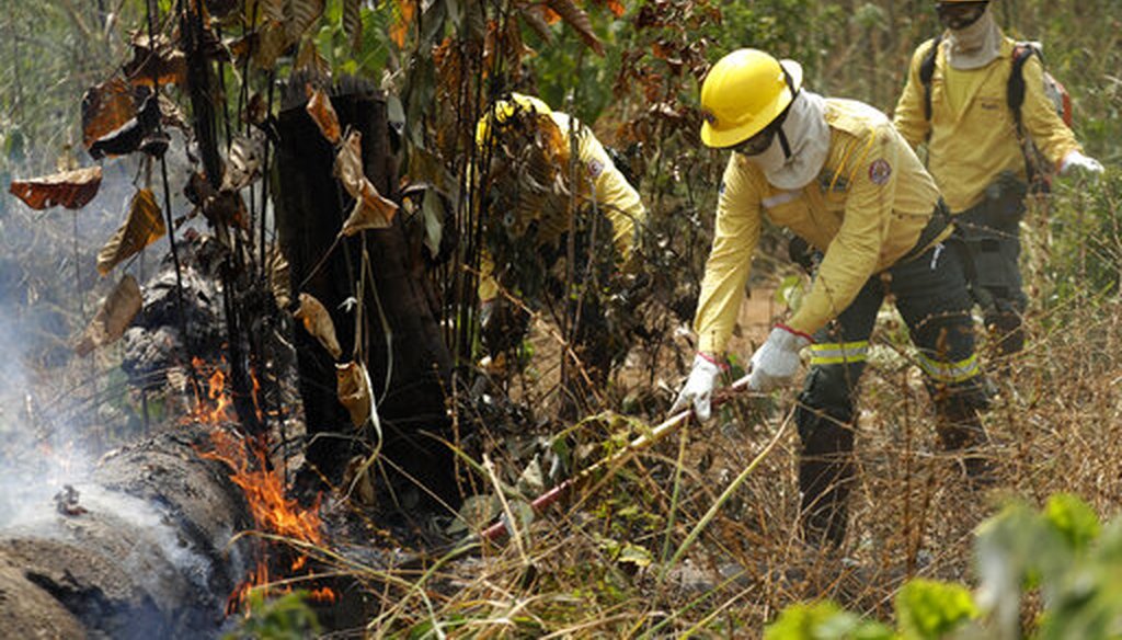 Firefighters work to put out forest fires in the Vila Nova Samuel region, part of Brazil's Amazon, Aug. 25, 2019. (AP Photo)