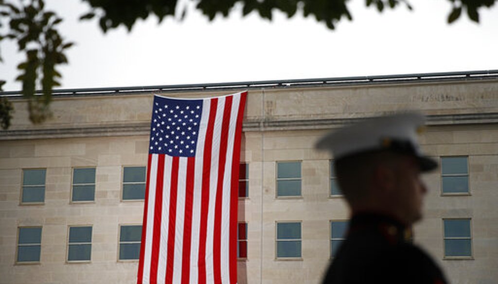 A flag hangs on the Pentagon before a ceremony in observance of the 18th anniversary of the September 11th attacks at the Pentagon in Washington, Sept. 11, 2019. (AP/Patrick Semansky)