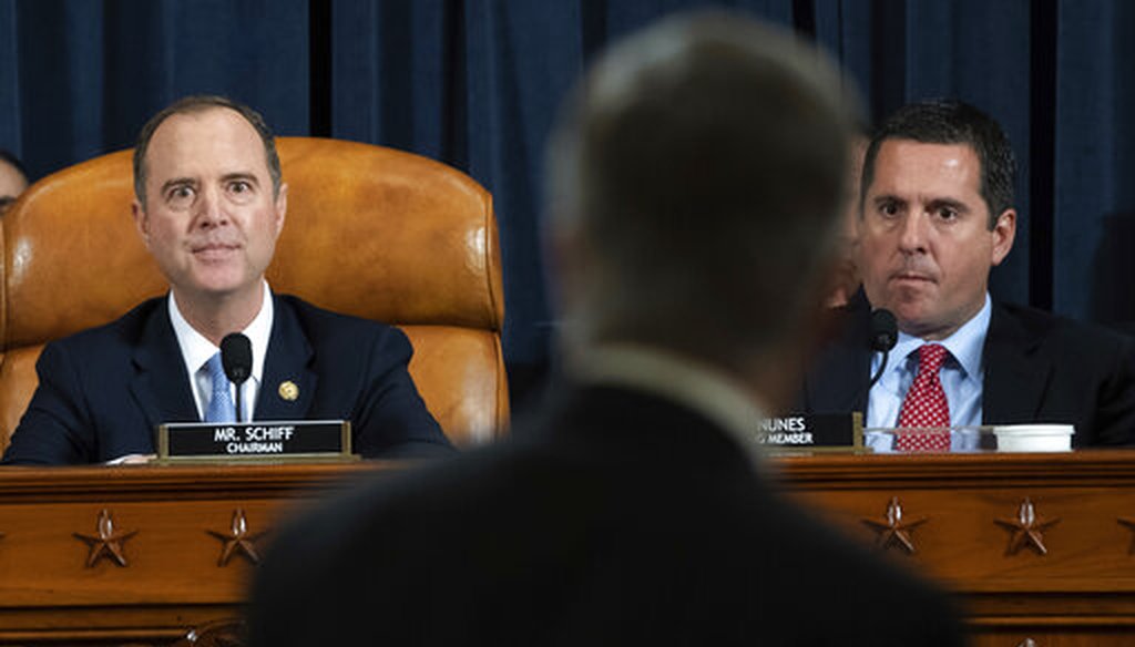 House Intelligence Committee Chairman Rep. Adam Schiff, D-Calif., and ranking member Rep. Devin Nunes, R-Calif., watch as Ambassador William Taylor leaves after testifying at a Nov. 13, 2019, hearing in Washington. (AP/Loeb)