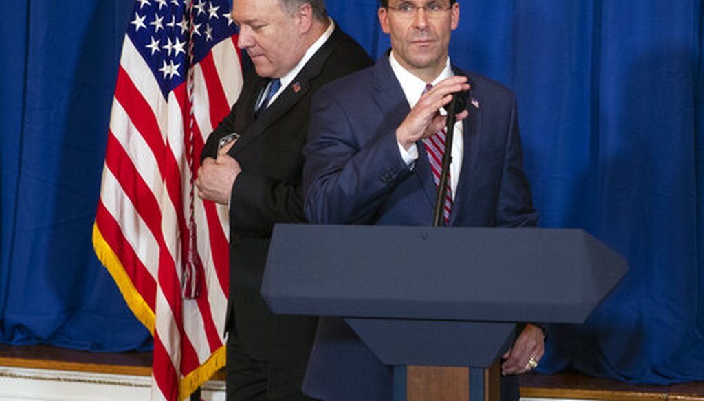 Secretary of State Mike Pompeo, left, hands off the microphone to Secretary of Defense Mark Esper to deliver a statement on Dec. 29, 2019, in Palm Beach, Fla. (AP/Vucci)