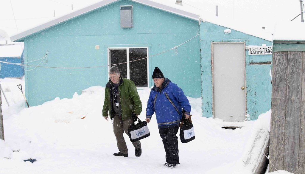 Census bureau director Steven Dillingham, right, walks alongside Census worker Tim Metzger after conducting the first enumeration of the 2020 Census on Jan. 21, 2020, in Toksook Bay, Alaska. (AP)